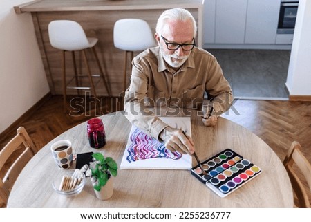 Similar – Image, Stock Photo Crop man painting on studio floor