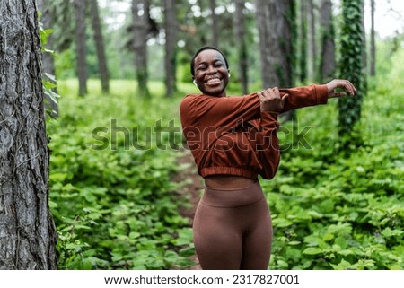 Similar – Woman stretching after running