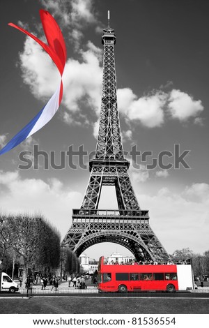 Eiffel Tower with flag and bus in Paris, France