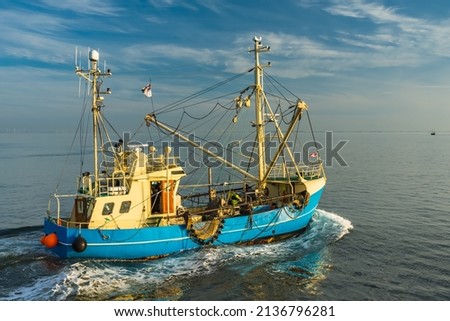Similar – Image, Stock Photo A fishing cutter, the danger buoy, sailing yachts on the Wadden Sea can be seen