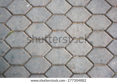 dirty patterned paving tiles, dirty cement brick floor background