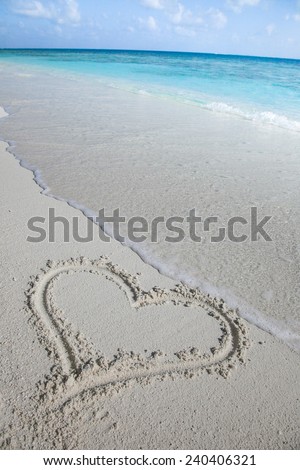 beautiful beach of maldives with heart in the sand
