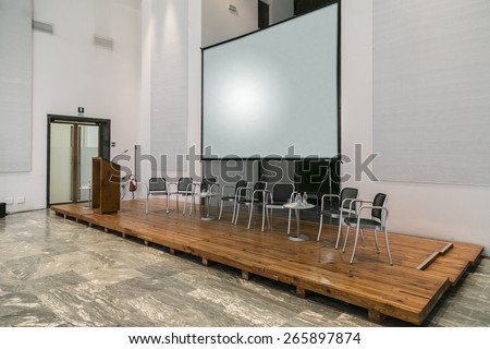 conference room fitted with screens and projectors