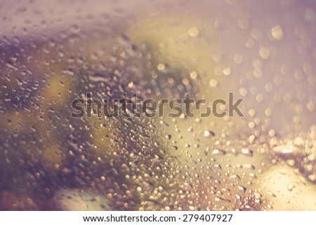 Vintage tone of :Drops Of Rain on the window with house in the back for Background