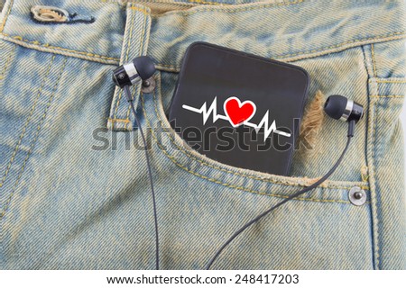 I love music in a pocket of a denim jeans as a background