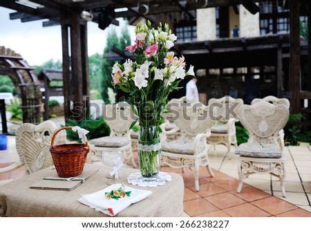 delicate wedding bouquet in a vase on the table. Away ceremony Rustic