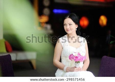 beautiful bride with a wedding bouquet of orchids