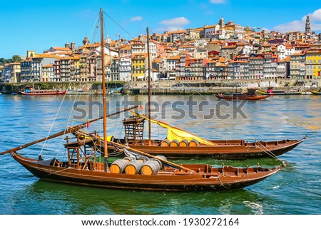 Cityscape of the city of Porto, Douro river with its old boat and its typical colored houses on the water's edge. Portugal. Europe. Stock foto © 