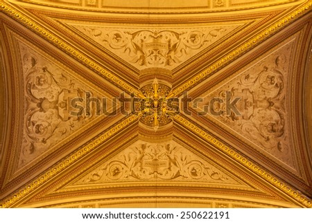 VATICAN CITY, ROME, ITALY - CIRCA JANUARY, 2015 - Golden decorations of a ceiling in Vatican Museums.