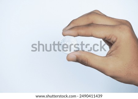 Similar – Image, Stock Photo hand holding 500 coins indonesian rupiah