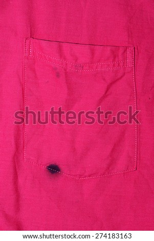 Close up of a Man\'s Pink Shirt stained by a Leaky Ink Pen