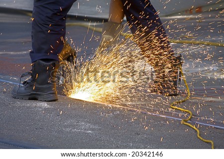 skilled worker grinding railroad track