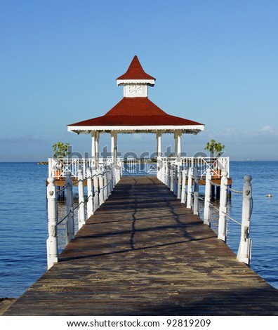 Beautiful pier leads out to Caribbean gazebo for a perfect place to hold your intimate wedding