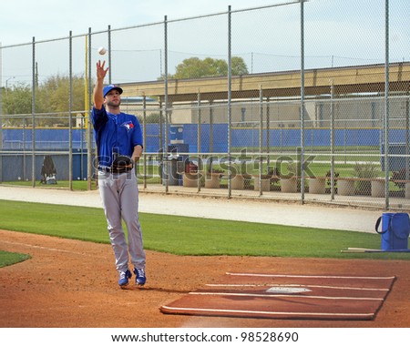 DUNEDIN, FLORIDA - FEBRUARY 25:  Brandon Morrow catches a ball at spring training on February 25, 2012.  Morrow will be the number 2 starting pitcher for the Toronto Blue Jays 2012 season.