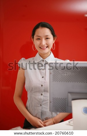 Attractive Asian young Career Woman - beautiful happy smiling with friendly and professional businesswoman on red wall background