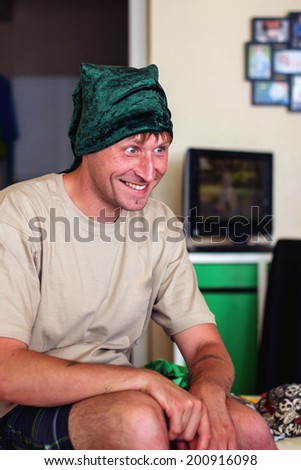 Man wearing a green elf hat -- image taken in Reno, Nevada, USA