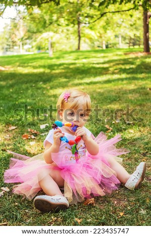 Young girl playing at park, celebrating her first birthday -- image taken at San Rafael park in Reno, Nevada, USA
