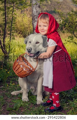 Little girl with a wolf . The fairy tale \