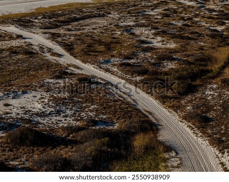 Similar – Foto Bild Sandstrand zwischen langen Klippen am Meer