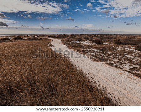 Similar – Foto Bild Sandstrand zwischen langen Klippen am Meer