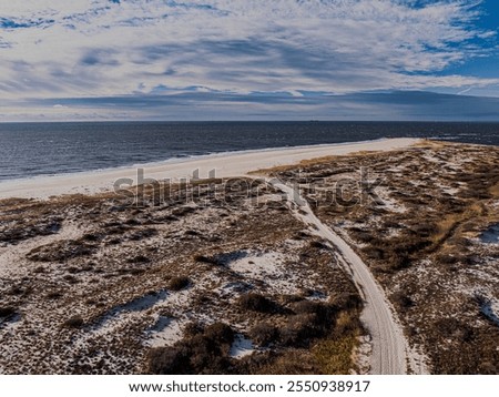 Similar – Foto Bild Sandstrand zwischen langen Klippen am Meer