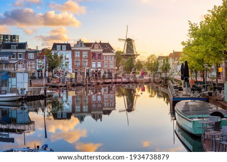 Leiden Old town cityscape, view of the Beestenmarkt and the De Valk mill reflecting in Rhine river on sunrise, South Holland, Netherlands ストックフォト © 