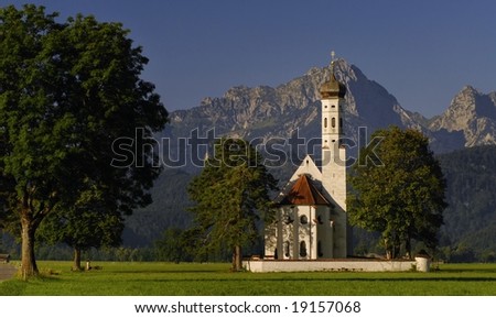 Christian church with mountains in backgrounds, Bavaria, Germany. It lays on the route of St. James from central Europe.