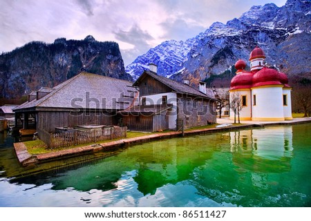 Mountain lake Konigsee in german Alps near Munich with St Bartholomew church