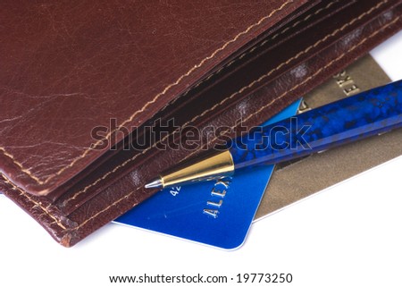 Credit cards, wallet and ball-point pen isolated on white