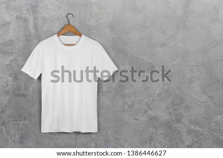  White Blank Cotton Tshirt Hanging Center Gray Concrete Empty Wall Background with clipping path ストックフォト © 