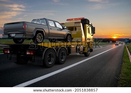 Tow truck with broken car on road.Tow Car and Pickup Truck are generic.3D illustration Сток-фото © 