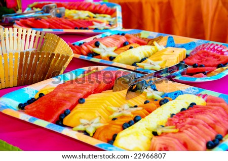 Colorful Fruit Assortment. Delightful diet of fresh sliced multicolored fruit on buffet table.