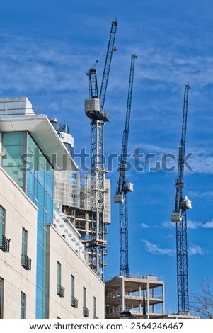 Similar – Image, Stock Photo High-rise building completely scaffolded