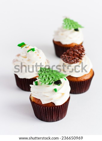 Decorated new year cupcakes on white background