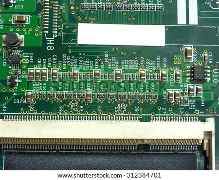 Big Electronic circuit board with radio components soldered on a green PCB
