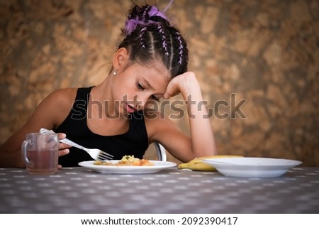 Portrait of cute girl who doens't want to eat meal in canteen Stockfoto © 
