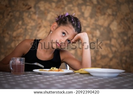 Portrait of cute girl who doens't want to eat meal in canteen Stockfoto © 