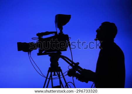 Cameraman silhouettes on a live studio