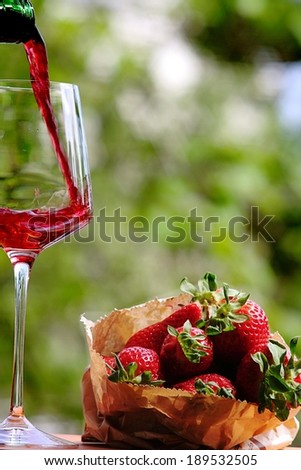Red wine and strawberries on a summer day