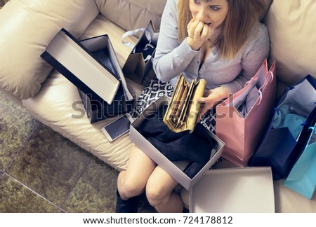 too much shopping young woman after over-spending looking at empty wallet.  concept of luxury addiction and consumerism ストックフォト © 