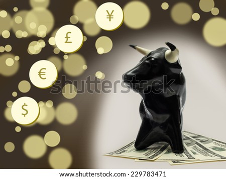 Dollar currency notes with bull on background with bokeh effect