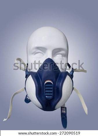 Plastic mannequin wearing protective dust mask with valve