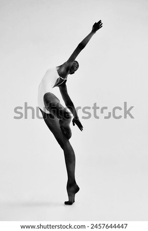 Similar – Image, Stock Photo Ballerina standing on tiptoe classical position outside