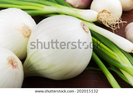 white onions on a wooden background