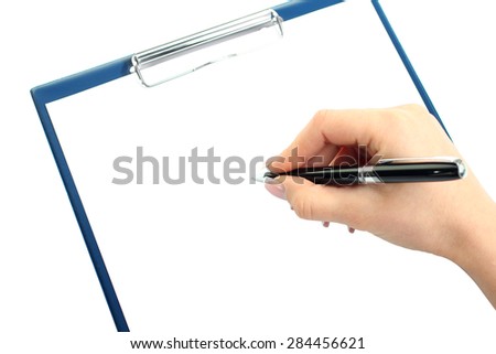 Closeup of a human hand writing with pen on clipboard; copy space