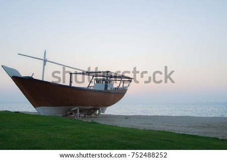 Arabic traditional wooden boat. Dawn time in Al Jubail in Saudi Arabia