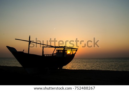 Arabic traditional wooden boat. Dawn time in Al Jubail in Saudi Arabia