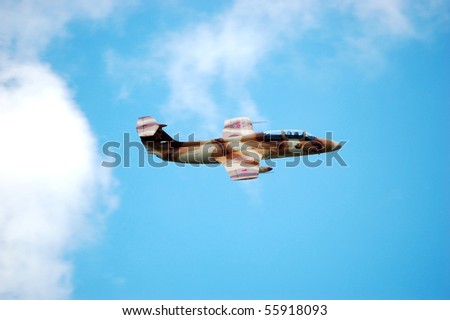 BRESLAU, ON, CANADA - JUNE 20: An L-29 Delfin Cold War-era military jet trainer, a type used by Warsaw Pact nations, performs at the Waterloo Aviation Expo and Air Show on June 20, 2010 in Breslau, Ontario.
