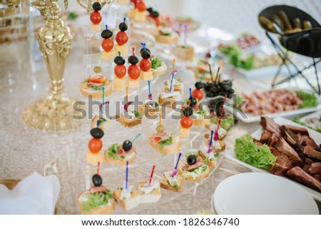 Tasty snacks kanapes on the buffet table Stock fotó © 
