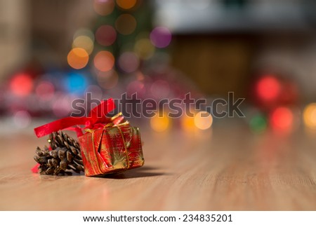 Little red boxes with gifts on wooden background. Christmas gifts